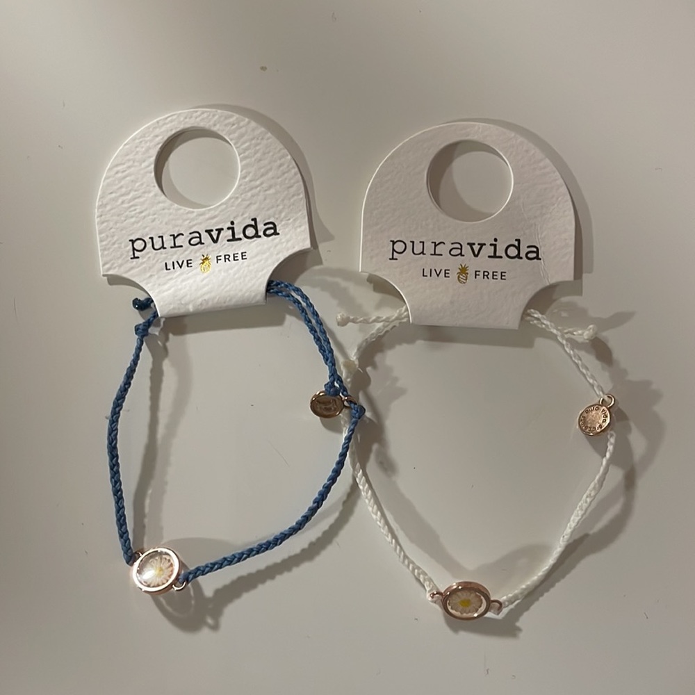 NWT Set of 2 Pura Vida Blue Bracelet with flower charm.